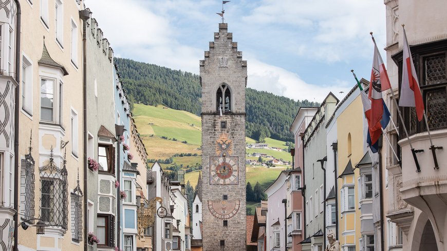 The laid-back town on the Isarco/Eisack river View of the Zwölferturm tower among colorful buildings in Sterzing, South Tyrol